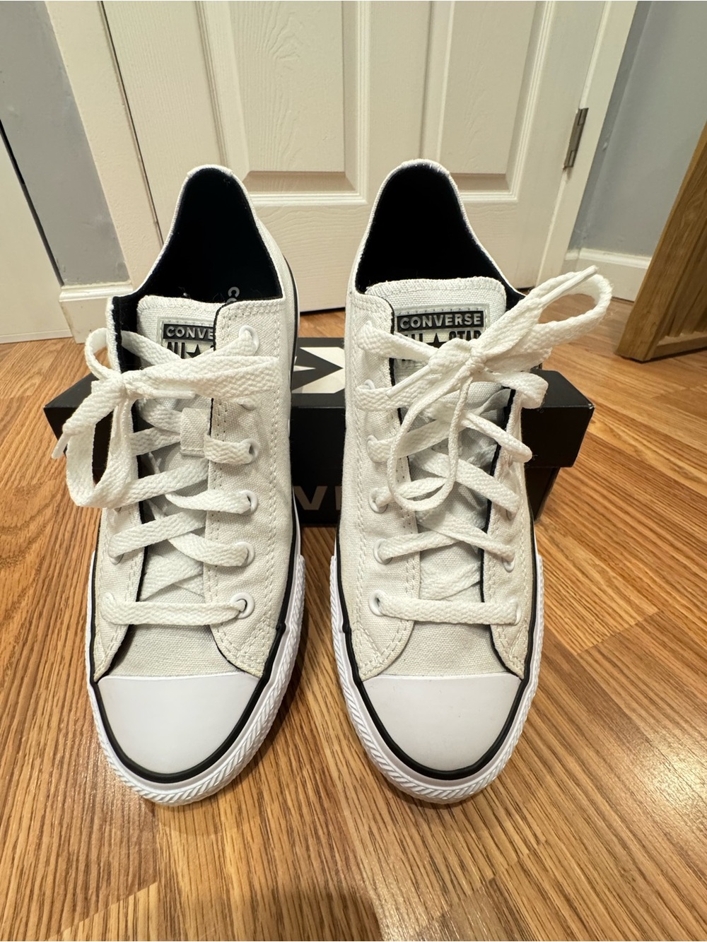 Converse Low Top Canvas Sneakers in White and Black Trim
